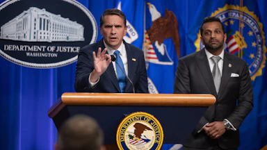 In April 2026, acting attorney general Todd Blanche gestured as he spoke at a press conference with FBI director Kash Patel about an indictment of the Southern Poverty Law Center.
