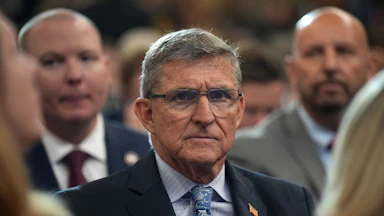 Former national security advisor Michael Flynn sits in an audience.