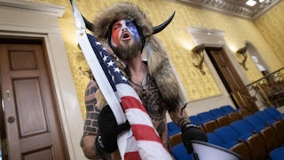 Jacob Chansley, the self-described "QAnon Shaman," shouts while standing in the U.S. Capitol during the January 6 riot