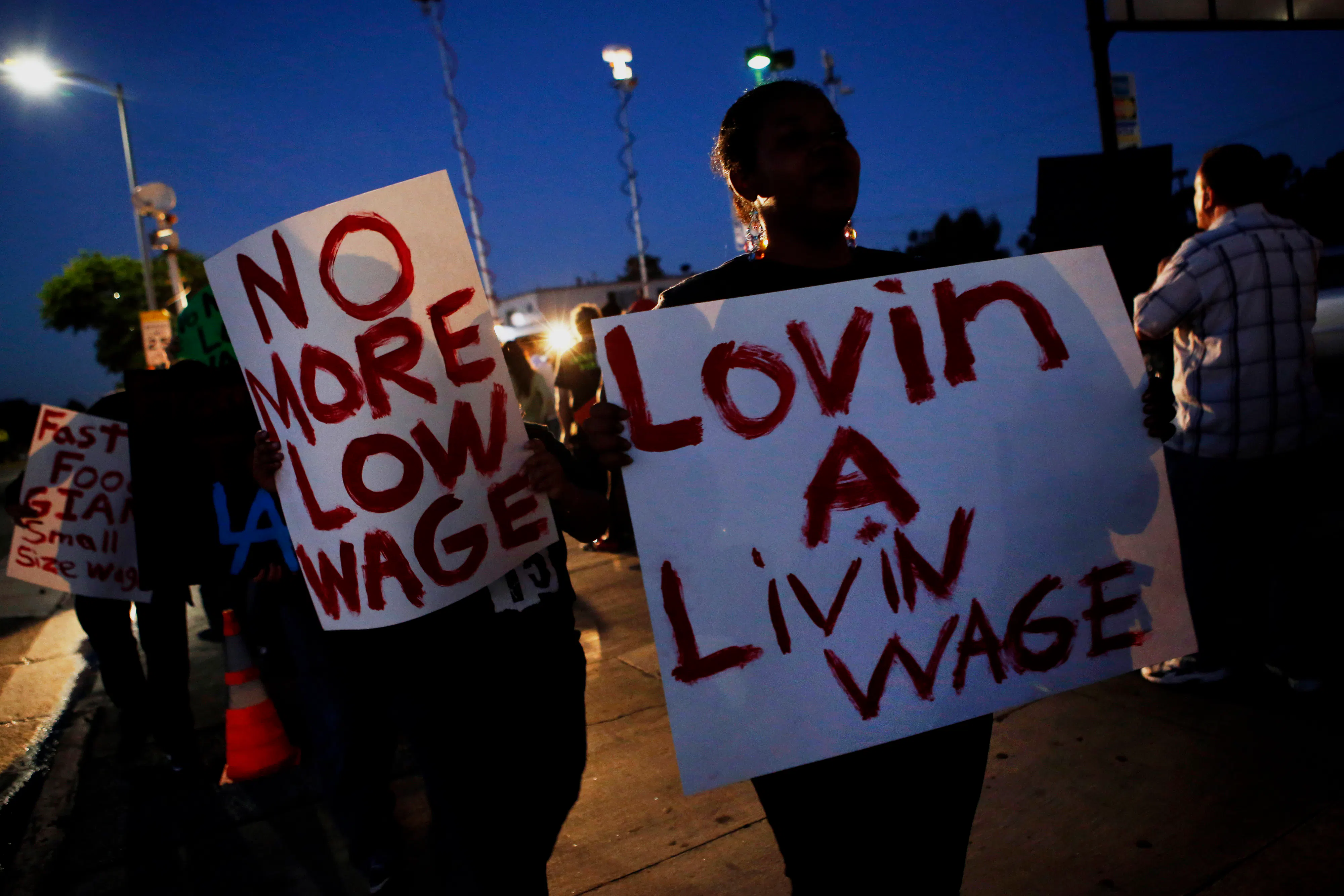 Fast-food workers and supporters organized by the Service Employees International Union protest outside of a Burger King in Los Angeles, California