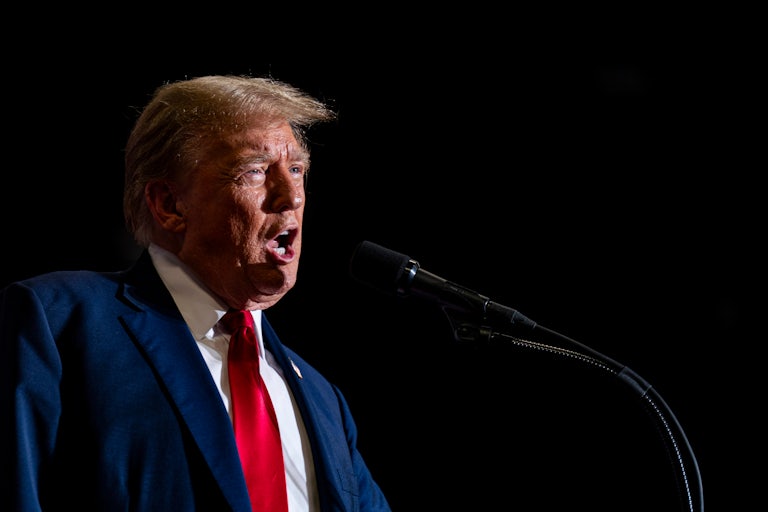 Donald Trump yells at a mic