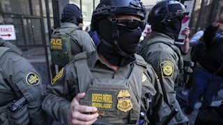 Masked Border Patrol agent