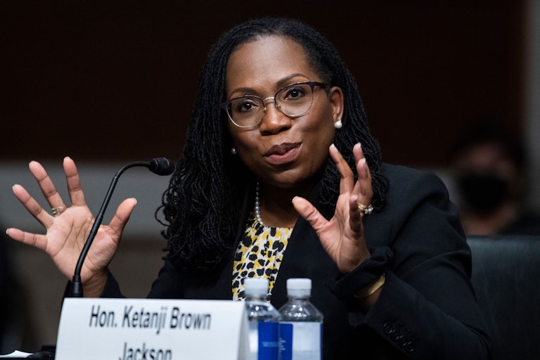 A close up of Ketanji Brown Jackson as she speaks during a confirmation hearing.