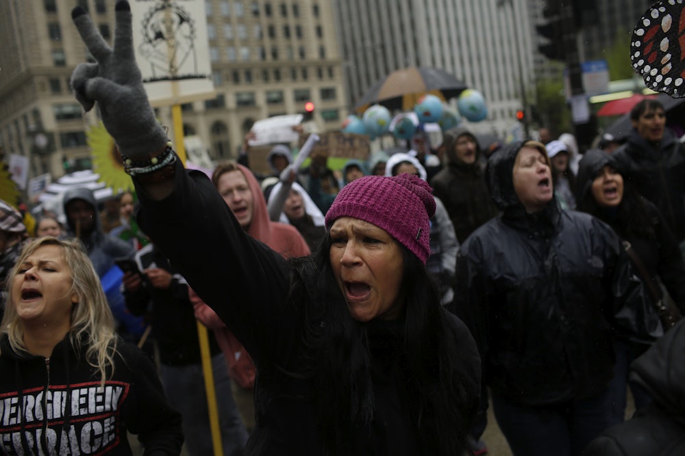 People's Climate March demonstrators chant outside Trump International Hotel & Tower in Chicago, Illinois.