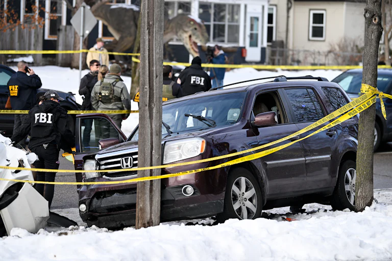 a car crashed into a telephone pole after ICE officers murdered its driver