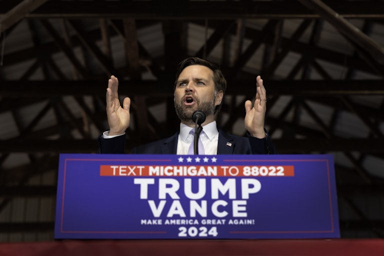 J.D. Vance gestures while speaking at a Donald Trump rally
