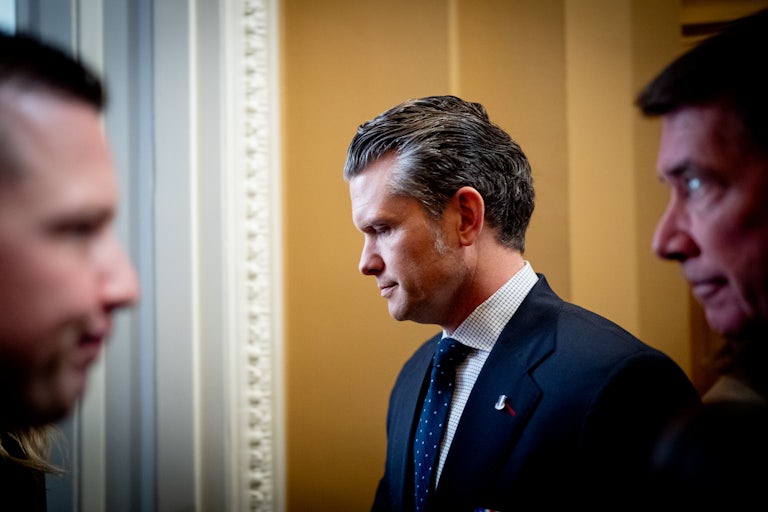 Pete Hegseth is seen in profile while on Capitol Hill