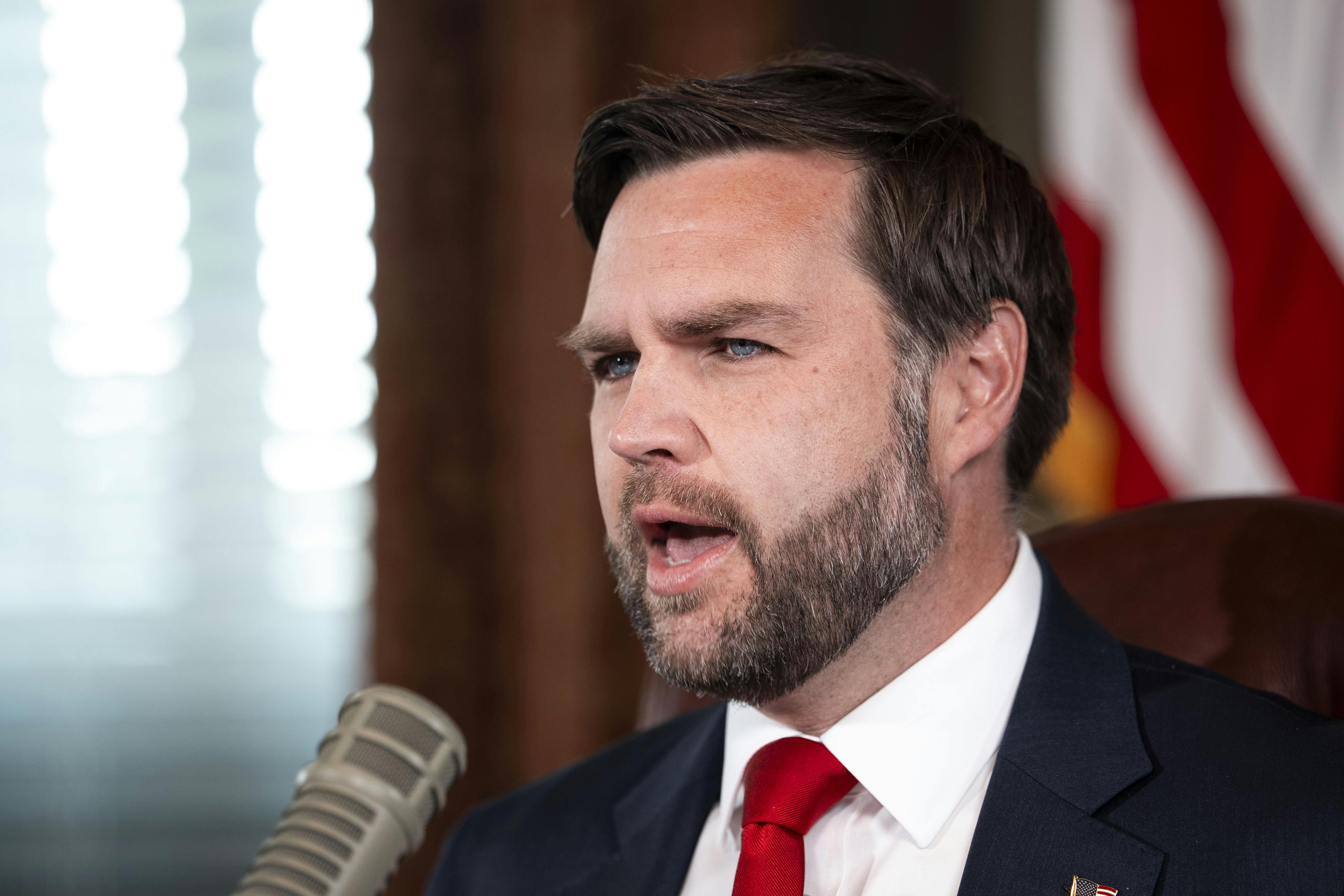 Vice President JD Vance speaks into a podcast microphone
