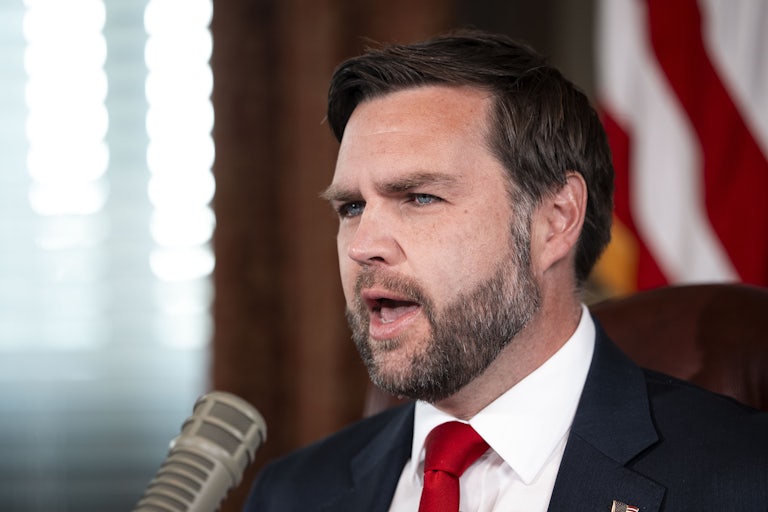 Vice President JD Vance speaks into a podcast microphone