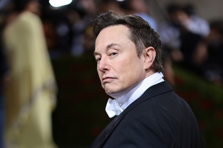Elon Musk looks backwards as he attends a fancy dress ball at the Metropolitan Museum of Art
