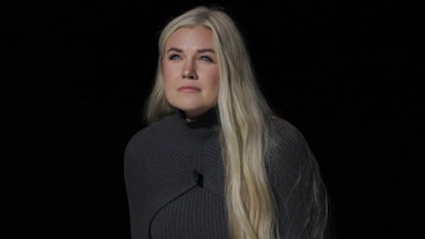 Erika Kirk walks onstage at a TPUSA event