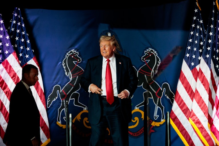 Donald Trump walks out during a campaign event
