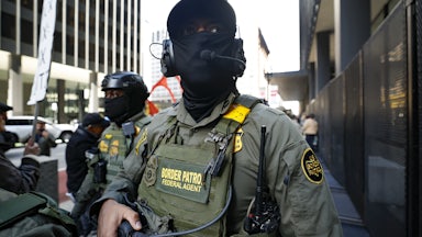 Two masked Border Patrol agents.