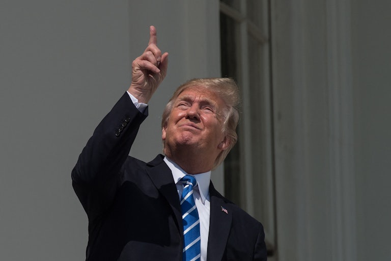 Trump looks up at sky