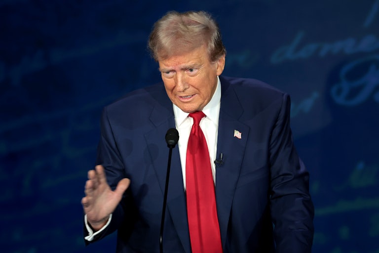 Donald Trump on the debate stage with Kamala Harris (not pictured)