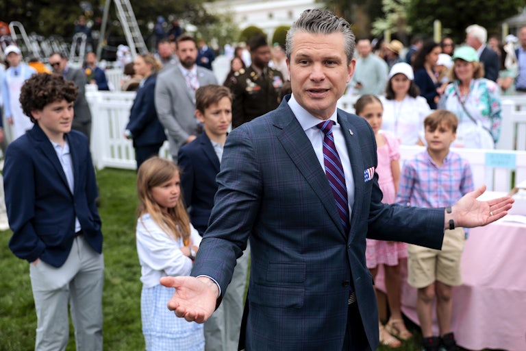 Defense Secretary Pete Hegseth shrugs on the lawn at the White House Easter Egg Roll.