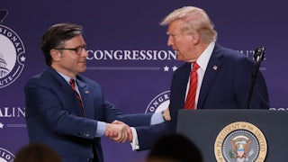 Donald Trump shakes hands with House Speaker Mike Johnson.