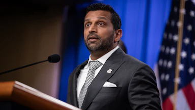 FBI Director Kash Patel speaks at a podium