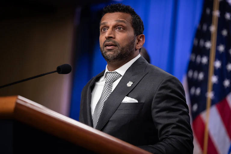 FBI Director Kash Patel speaks at a podium