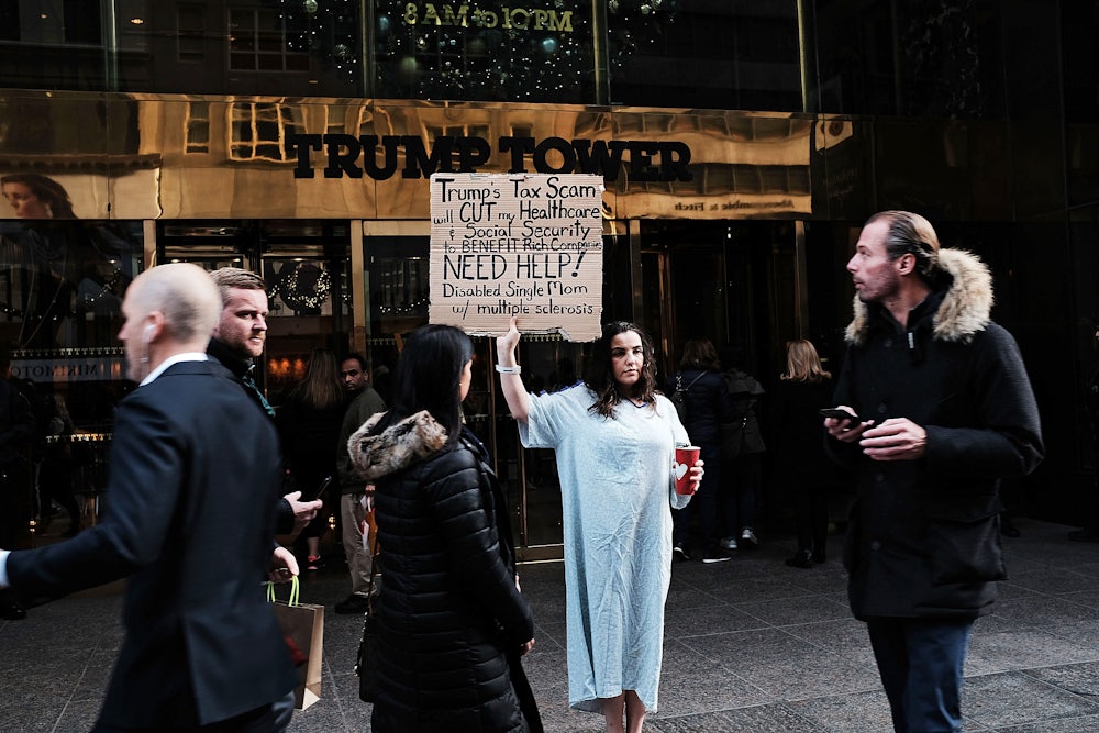 Outside Trump Tower, a woman protests the Trump administration's proposed tax cut, 2017.