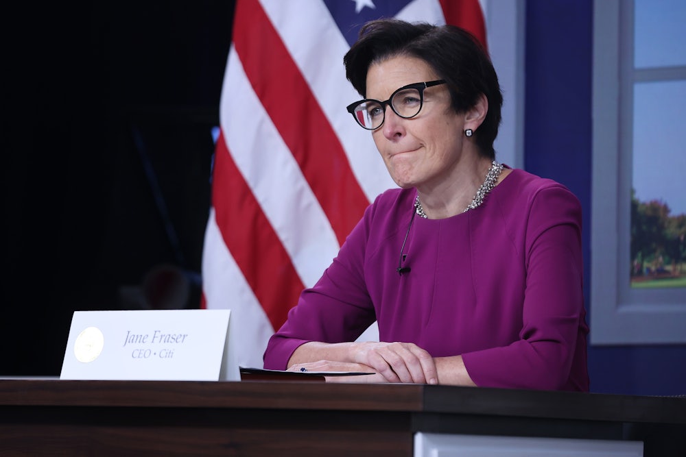 Citi CEO Jane Fraser sits at a table behind a placard with her name on it.