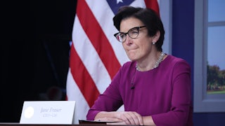 Citi CEO Jane Fraser sits at a table behind a placard with her name on it.