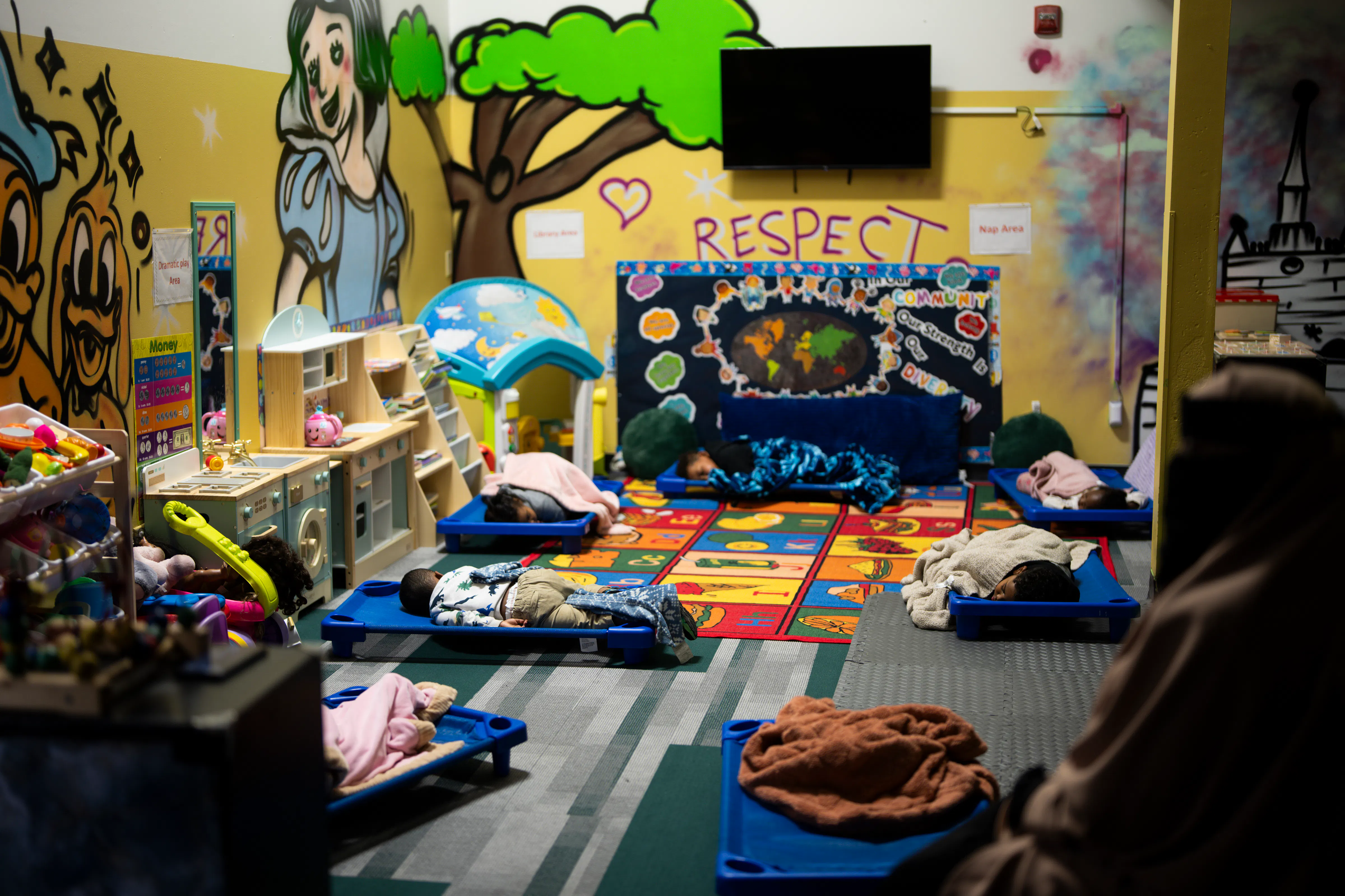 Children sleep during nap time at a daycare.
