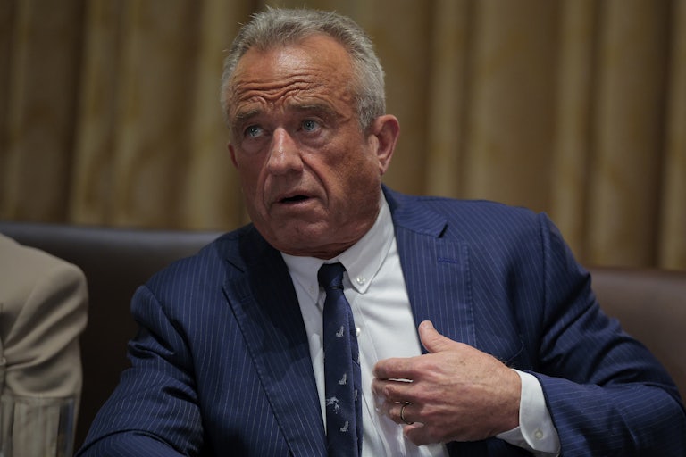 HHS Secretary RFK Jr. sits in a press conference.