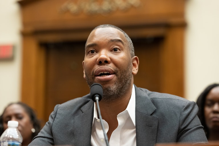 Ta-Nehisi Coates speaks into a microphone