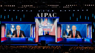 Israeli Prime Minister Benjamin Netanyahu speaks on two giant screens at the AIPAC conference.