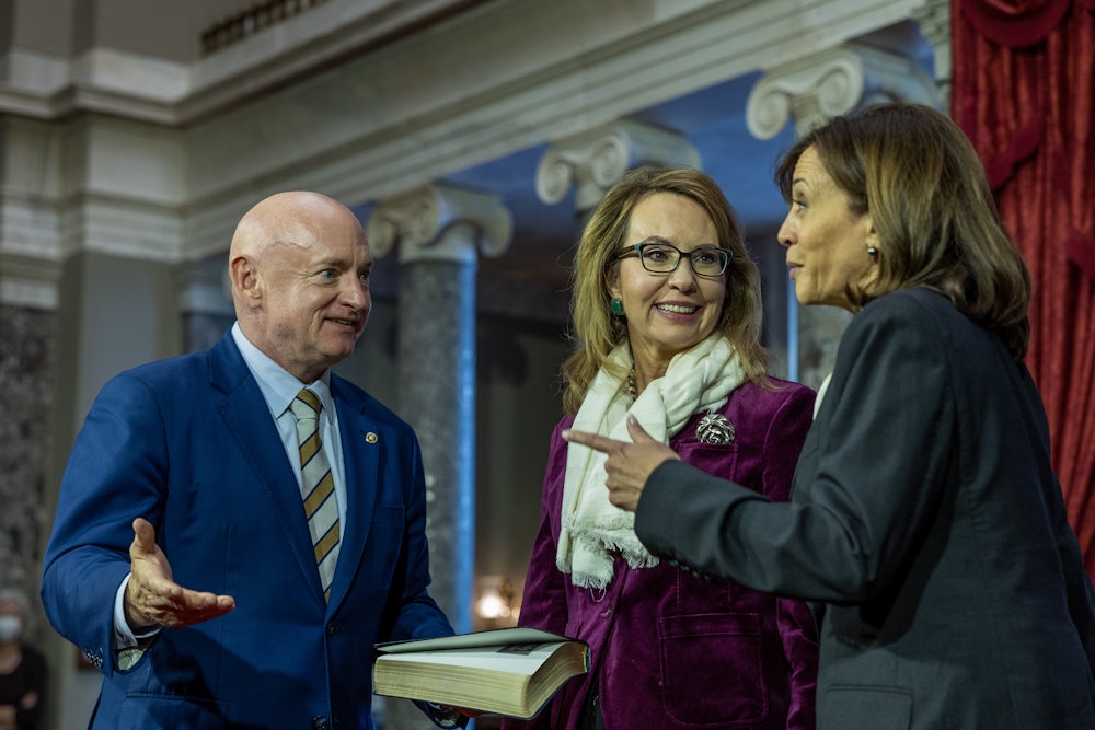 Vice President Kamala Harris with Mark Kelly and his wife, Gabrielle Giffords, at Kelly's swearing-in.