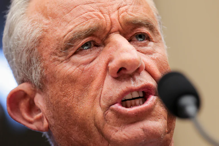 Health Secretary Robert F. Kennedy Jr. speaks into a microphone during a House committee hearing