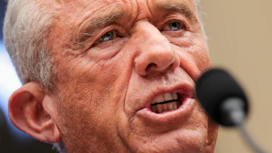 Health Secretary Robert F. Kennedy Jr. speaks into a microphone during a House committee hearing