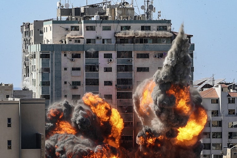 Explosions are seen as the Israeli military strikes the headquarters of the Associated Press in Gaza.