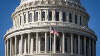 Capitol building with American flag in front