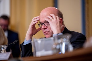 Representative Jim McGovern puts his hands on his temples as if in exasperation