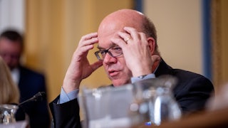 Representative Jim McGovern puts his hands on his temples as if in exasperation