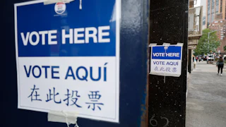 "Vote here" signs outside a polling station