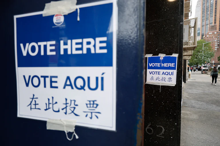 "Vote here" signs outside a polling station