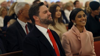 JD Vance and Usha Vance smile while seated in church. Vance's eyes are closed.