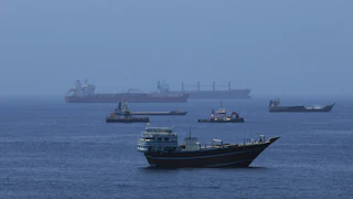 Commercial cargo vessels and crude oil tankers in the water
