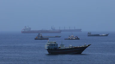 Commercial cargo vessels and crude oil tankers in the water