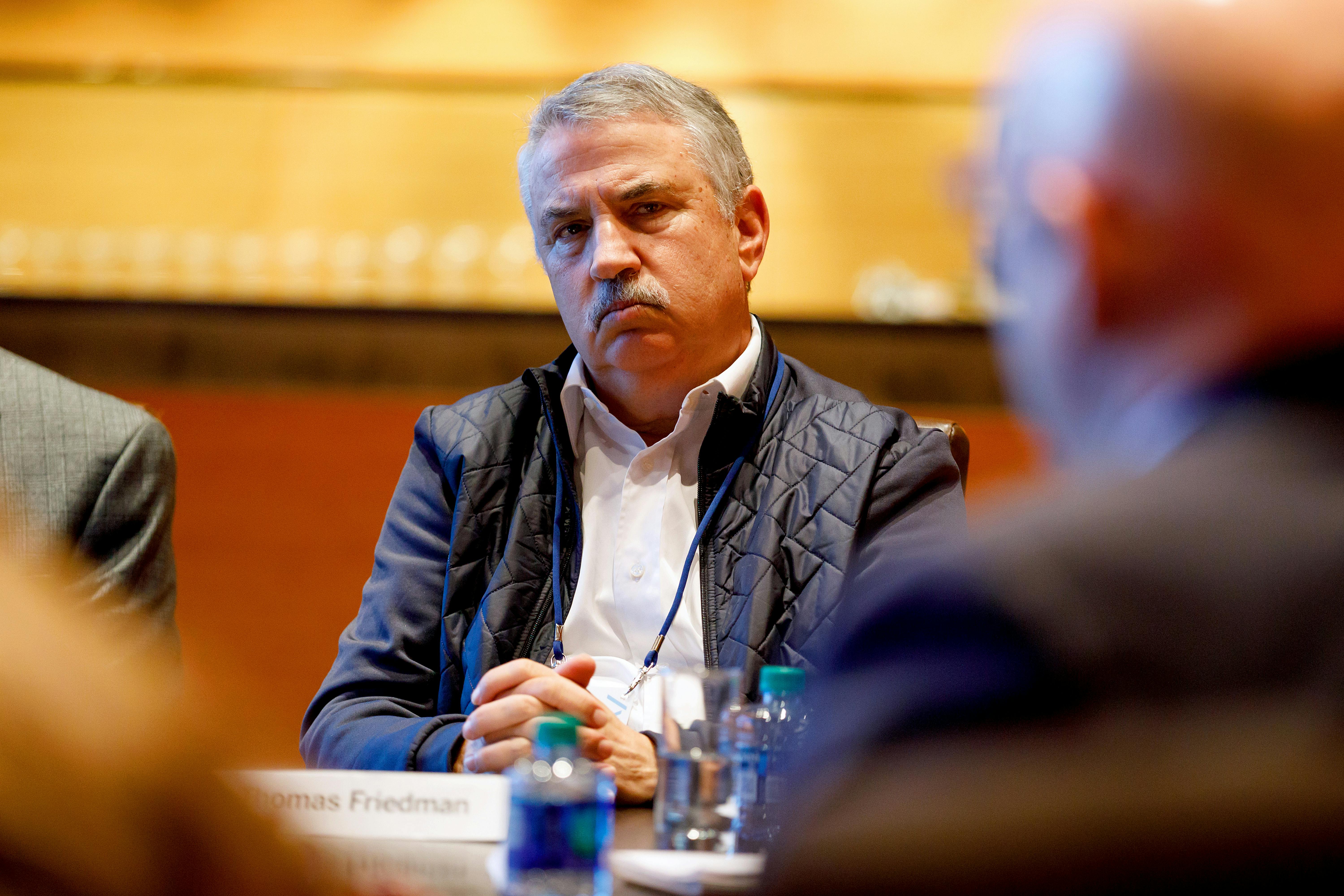 New York Times columnist Thomas Friedman scowls during a meeting.