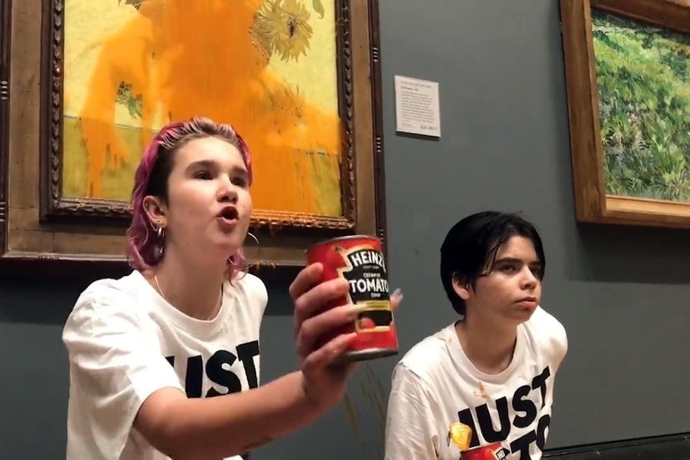 Protester with can of tomato soup and Vincent van Gogh's "Sunflowers"