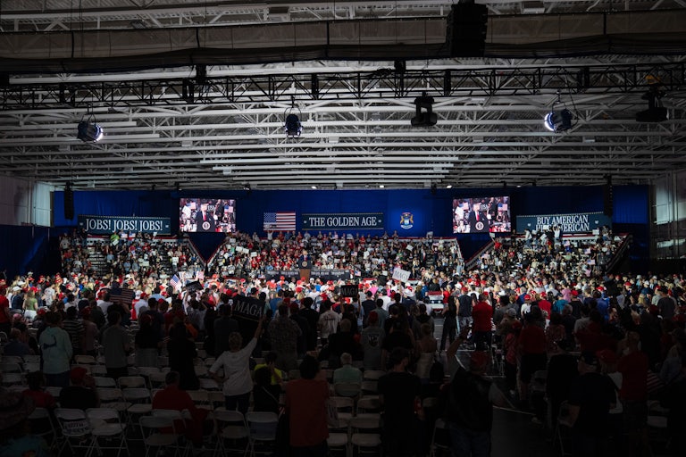 Empty seats are visible in the crowd at Donald Trump’s rally