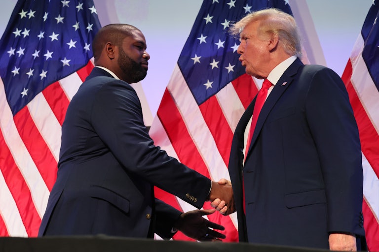 Byron Donalds and Donald Trump shake hands