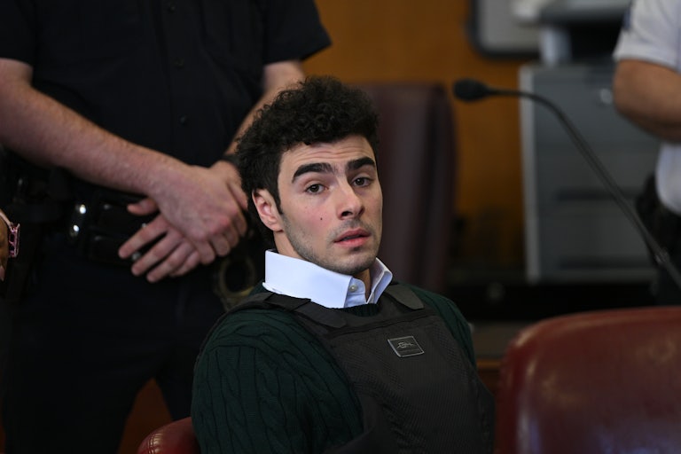 Luigi Mangione sits in court.