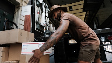 Carlos, a UPS worker in Manhattan, delivers packages
