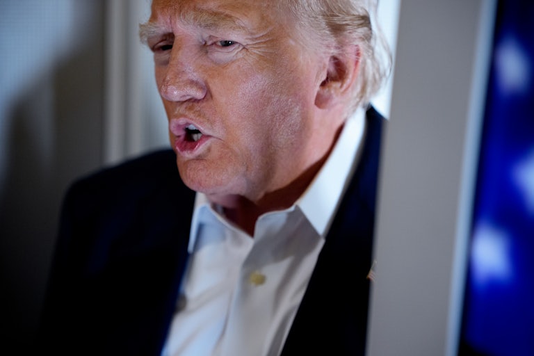 Donald Trump speaks to reporters on Air Force One