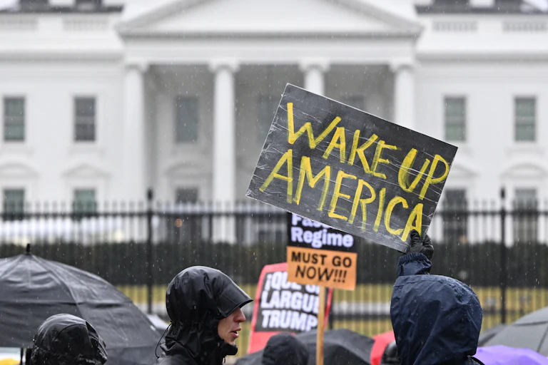 People protest in front of the White House in Lafayette Square Park in January 2026